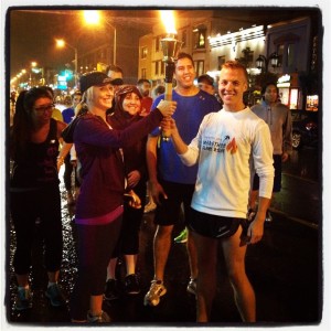 Heather from Tribe Fitness passing the marathon flame to the Digital Champions. Photo by Amber Renton